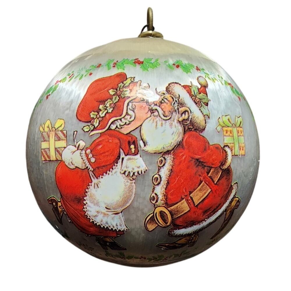 1981 P.C.A. International Santa kissing Mrs Claus Satin Christmas Ornament